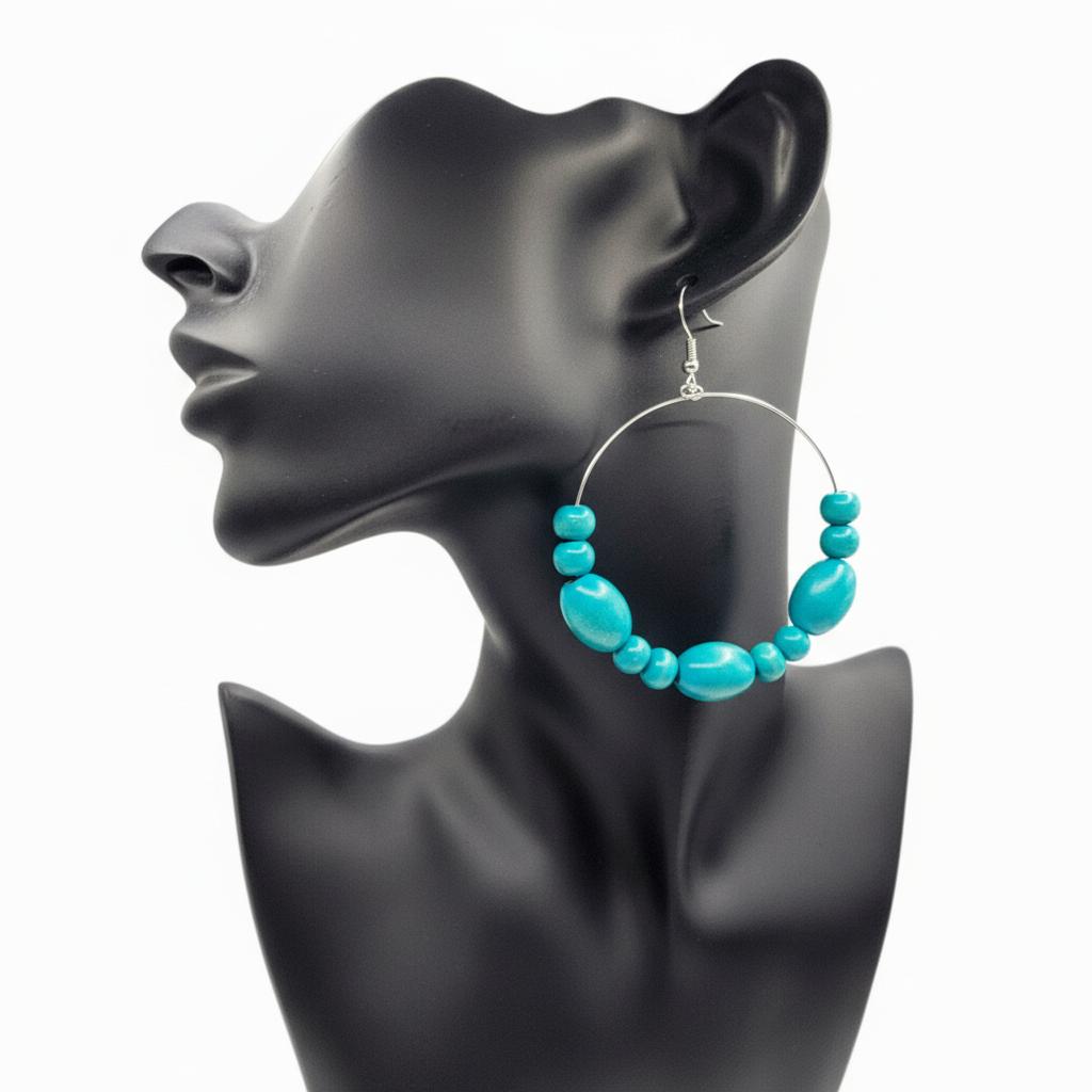 Turquoise hoop earrings on a black mannequin head