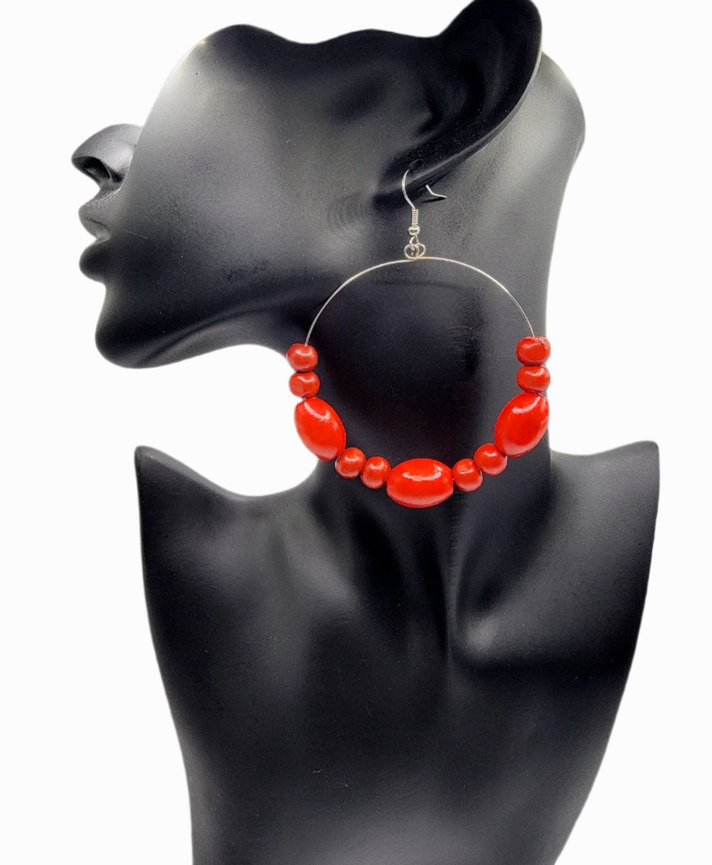 single red wood bead hoop earring on a mannequin bust 